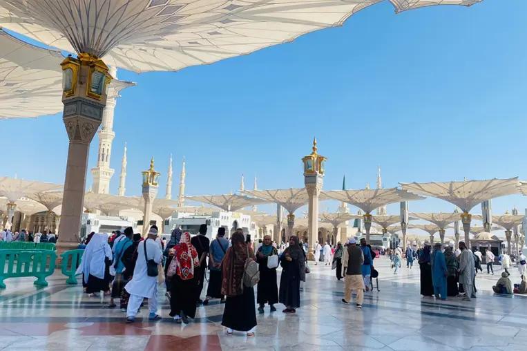 Pilgrims in the courtyard of Masjid an-Nabawi, Madinah
