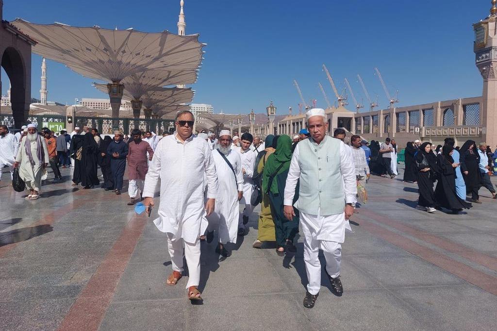 Pilgrims walking through the courtyard of Masjid an-Nabawi, Madinah